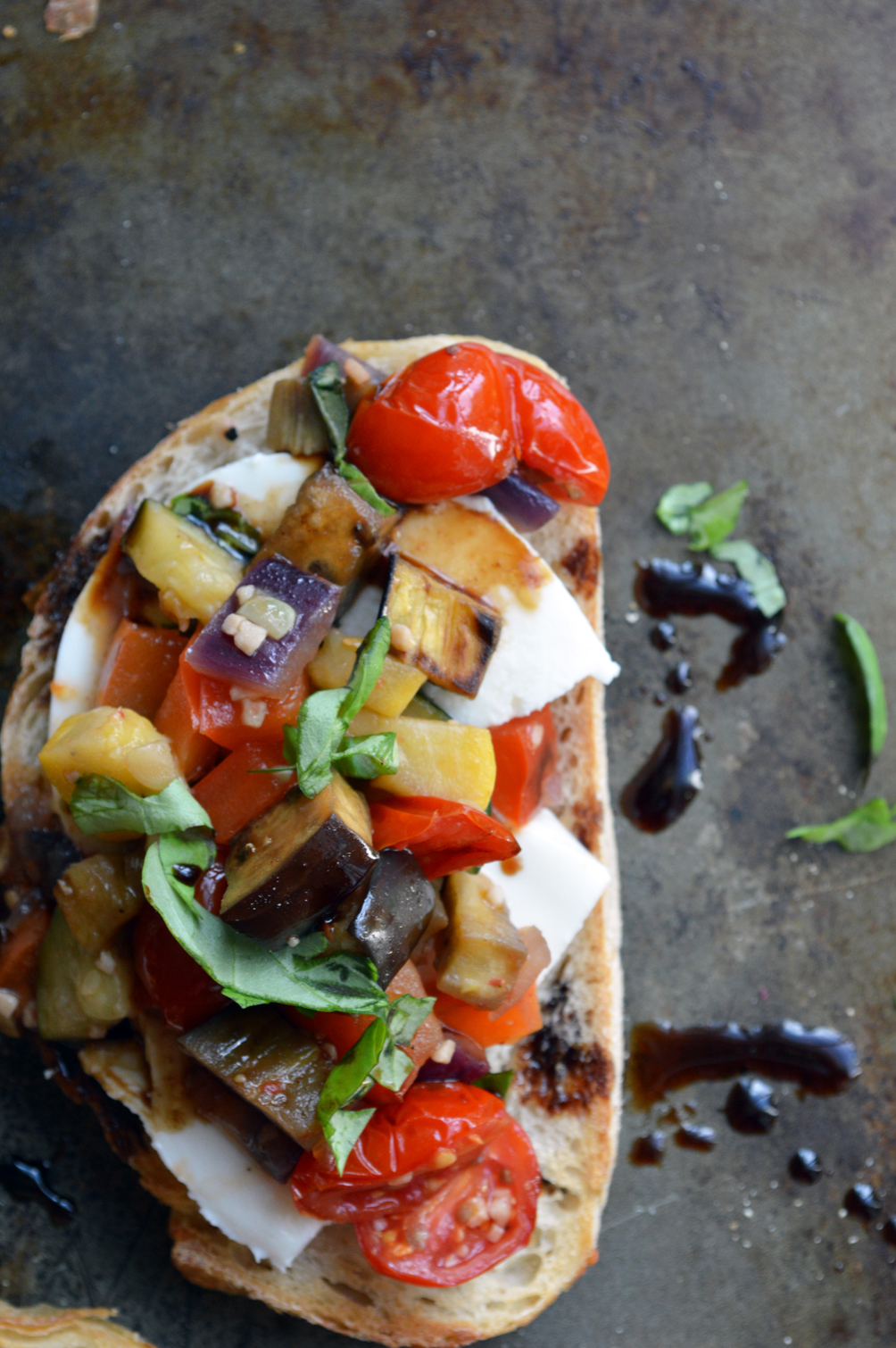 ratatouille tartine with balsamic drizzle and goat cheese