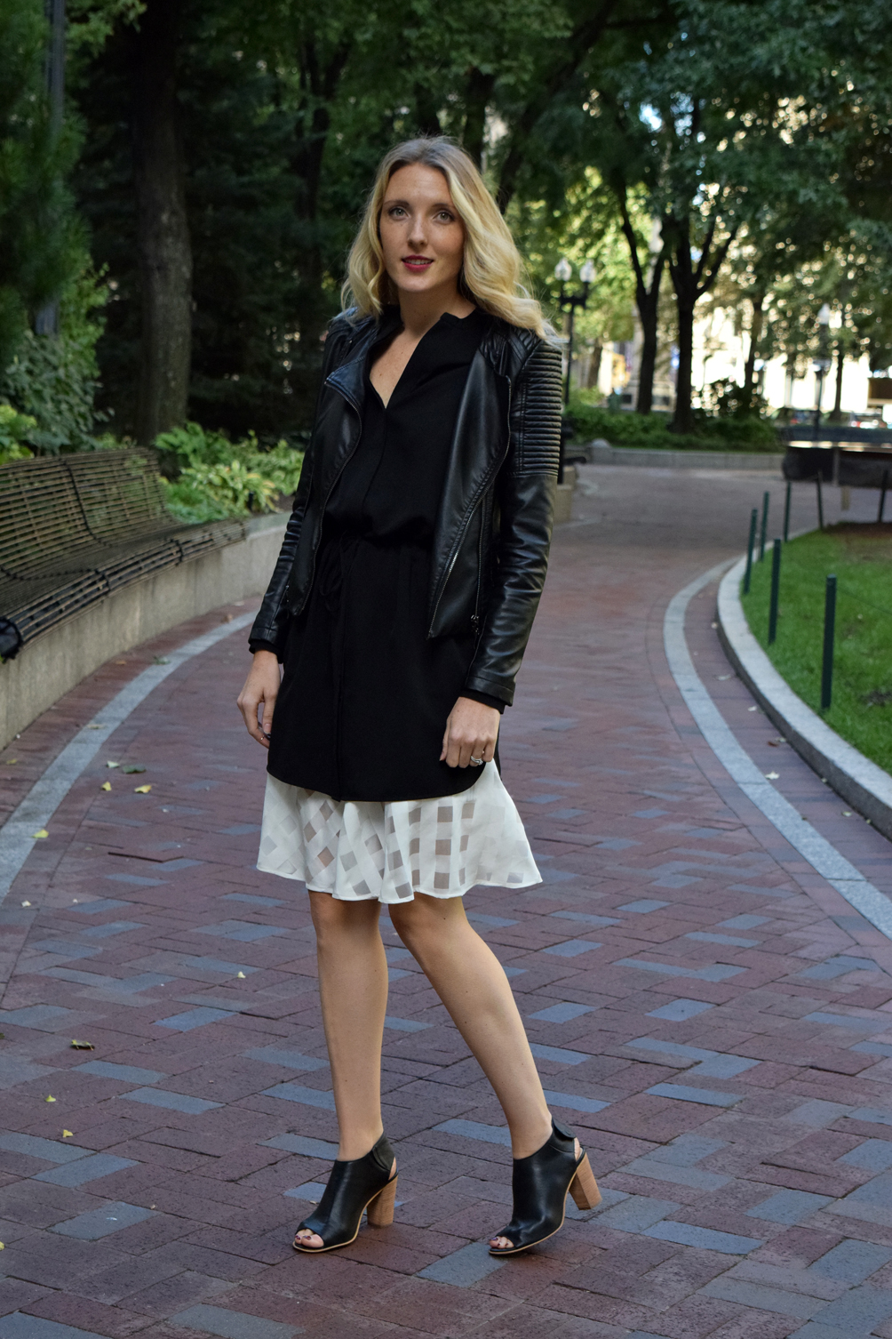 layered dress over a checkered skirt with ankle leather jacket