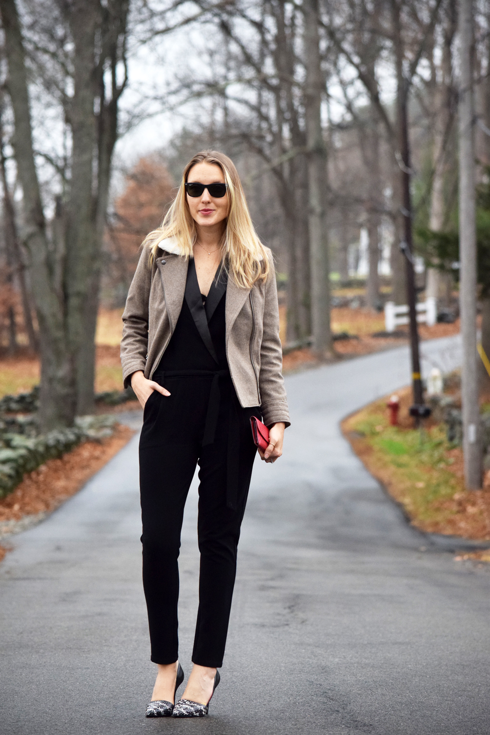 holiday jumpsuit outfit with a shearling collar jacket