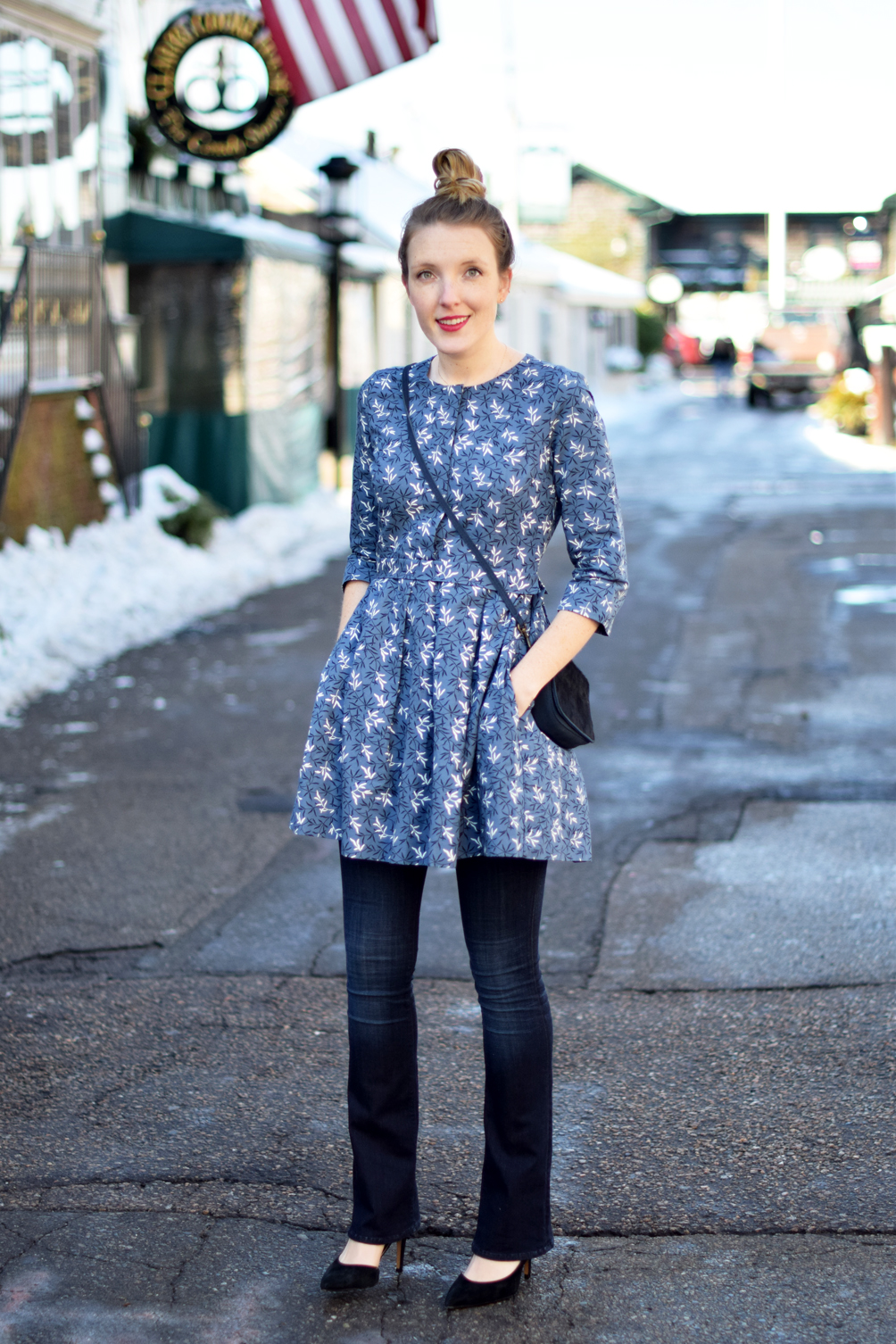 patterned flared dress over jeans winter outfit - one brass fox