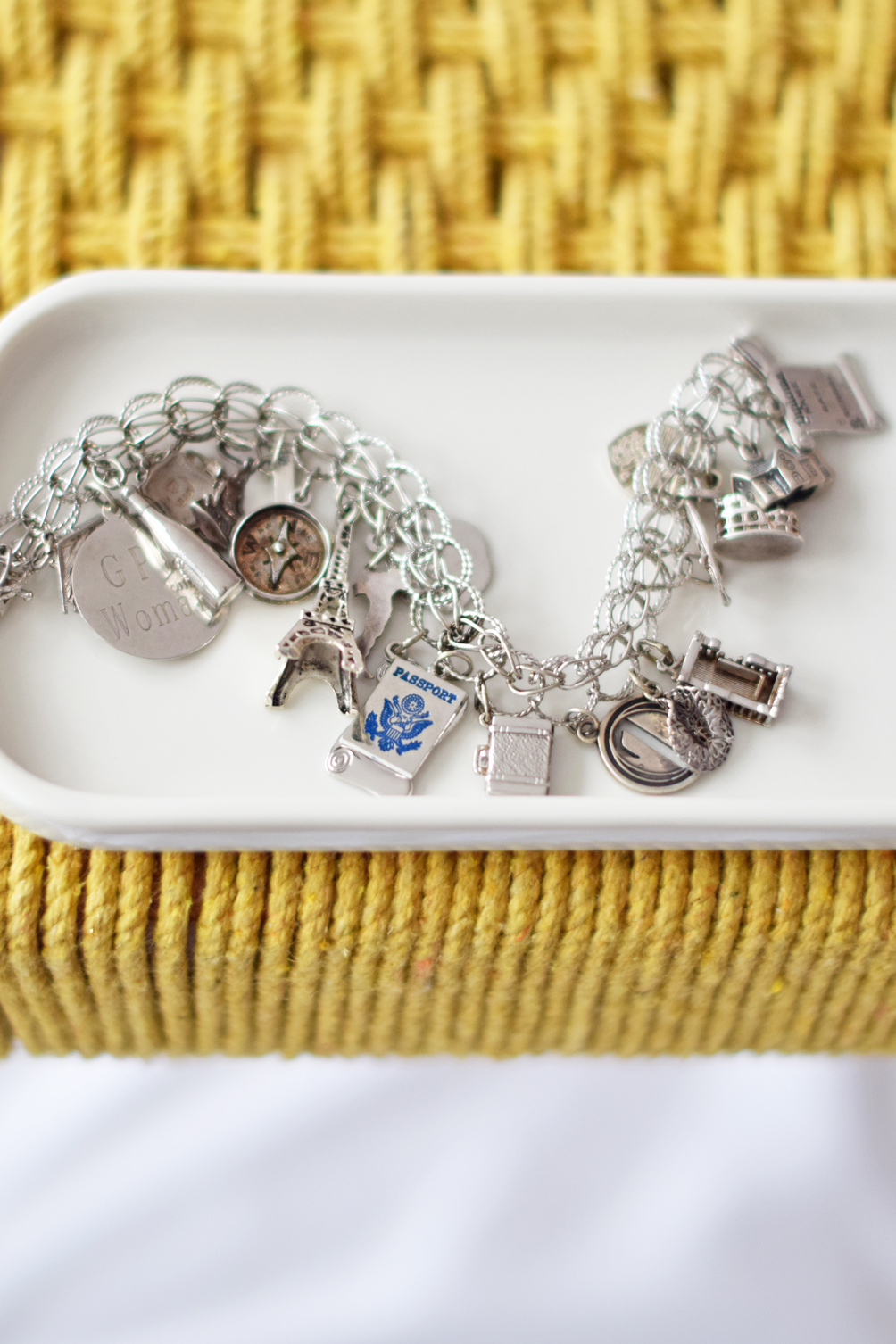 travel themed charm bracelet in sterling silver and white gold - one brass fox
