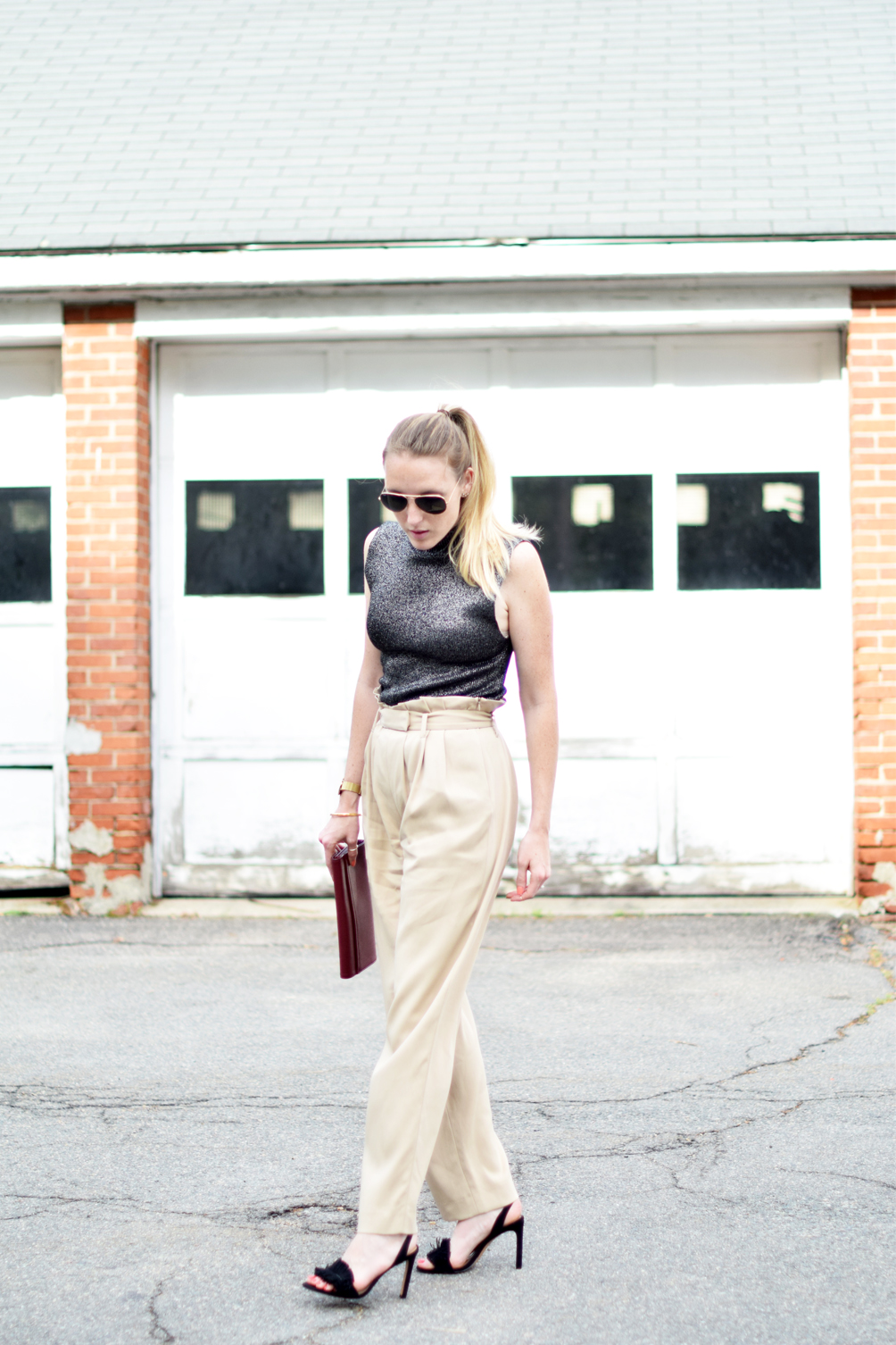 belted wide leg trousers with a mock neck crop top, fringed sandals, oxblood clutch, and aviators - leslie musser, one brass fox