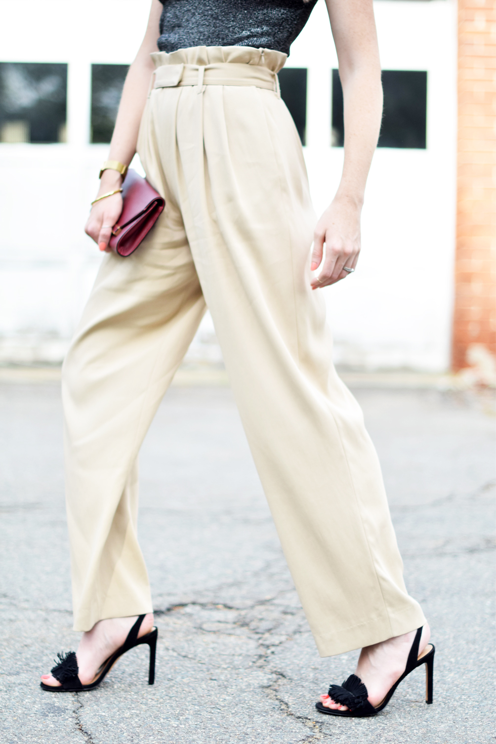 belted wide leg trousers with a mock neck crop top, fringed sandals, oxblood clutch, and aviators - leslie musser, one brass fox