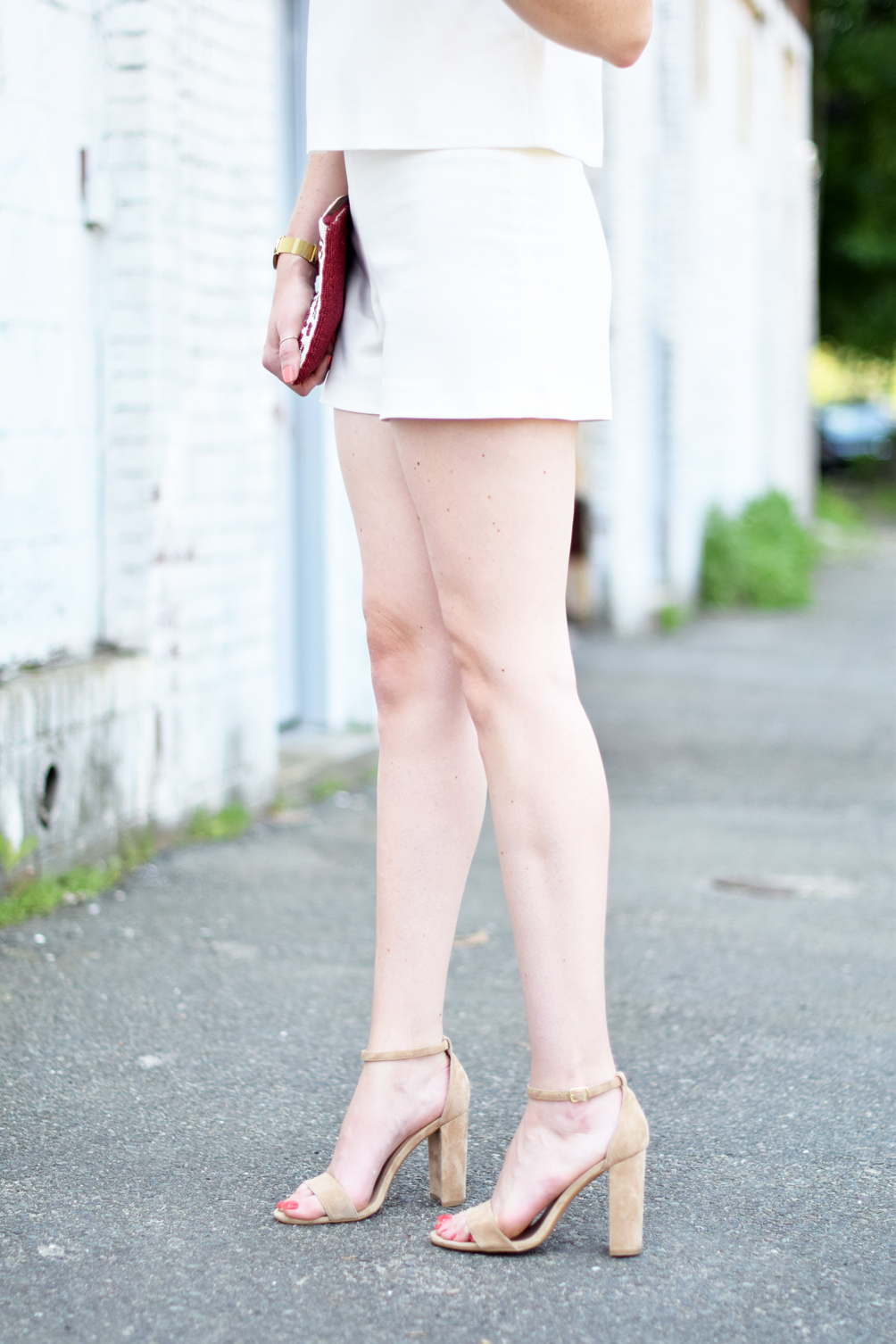 Leslie Musser of one brass fox shares summer style inspiration with a button back white romper