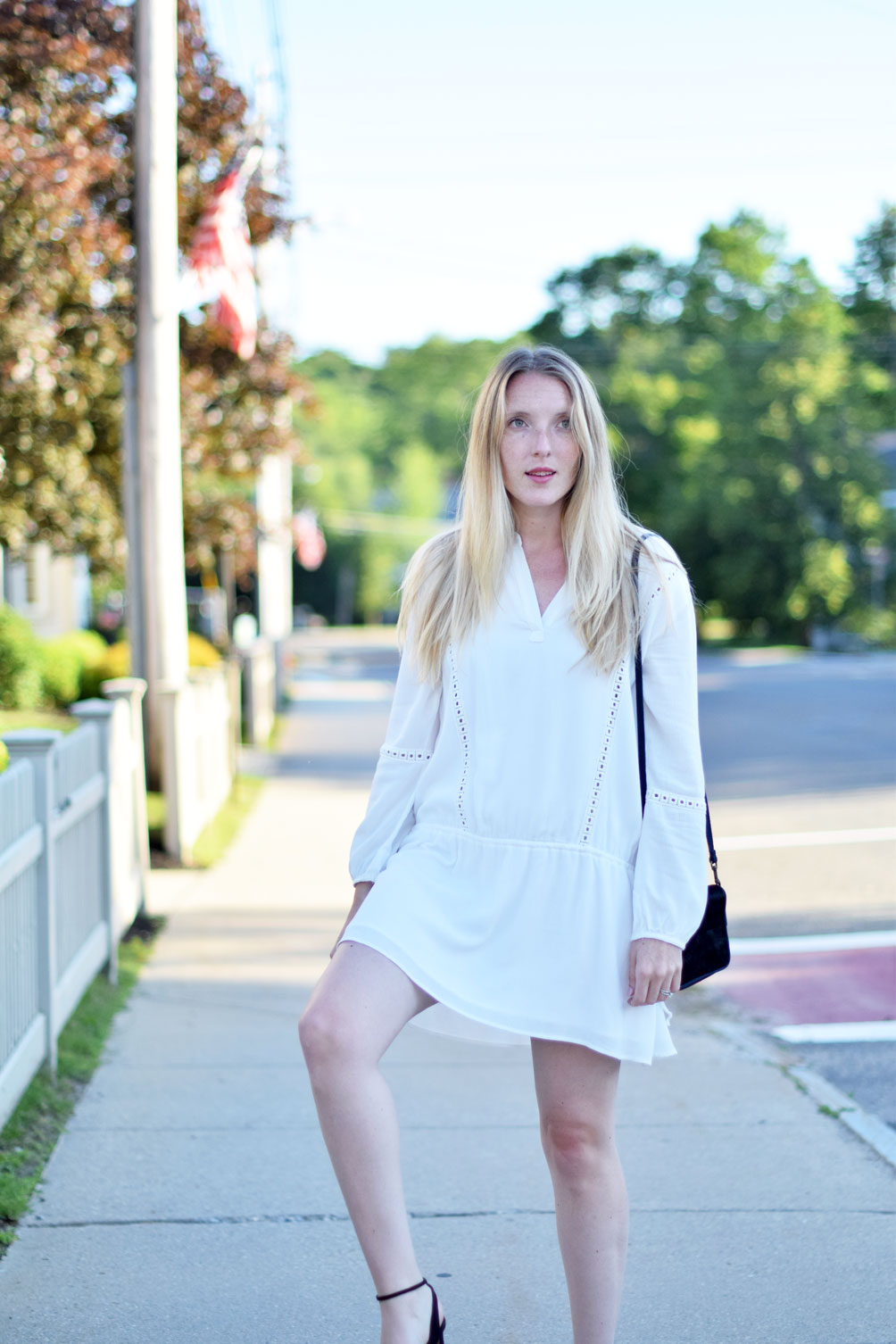 Leslie Musser of one brass fox shows off a summer LWD in this boho drop waist dress with fringe sandals