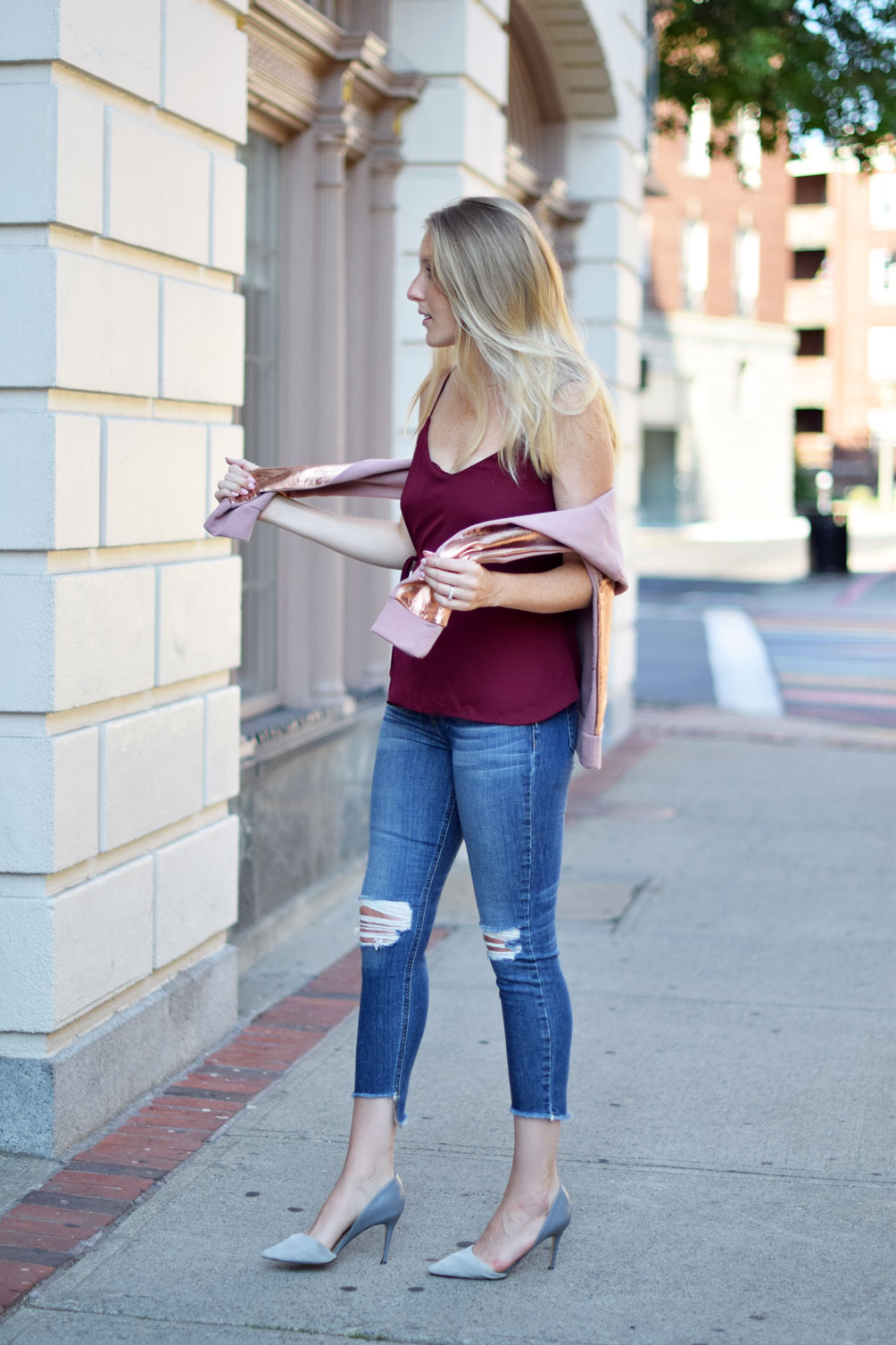casual summer style with @Nordstrom wearing a wrap front blouse, destroyed skinny jeans, and metallic brushed sweatshirt from fashion blogger Leslie Musser, one brass fox