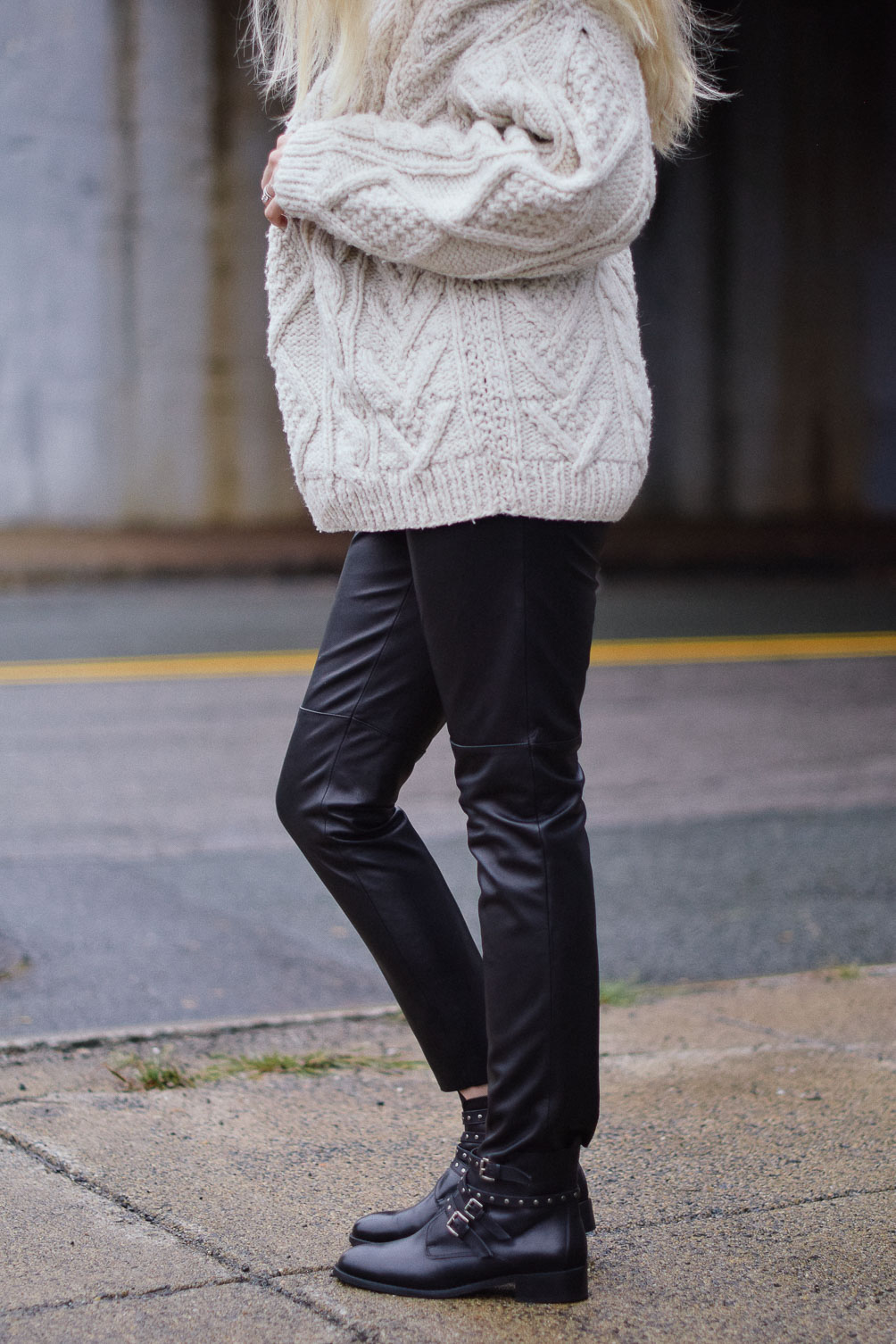 Leslie Musser edgy fall style with fisherman sweater leather jogger pants and black buckle booties one brass fox