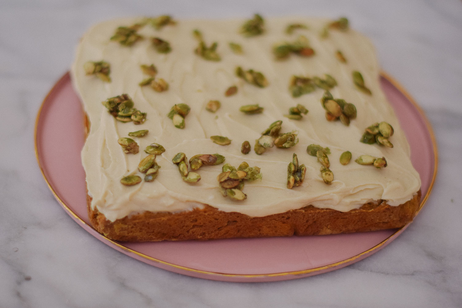 easy and delicious fall recipe ideas - sweet potato cake with candied pipits and cream cheese frosting on one brass fox