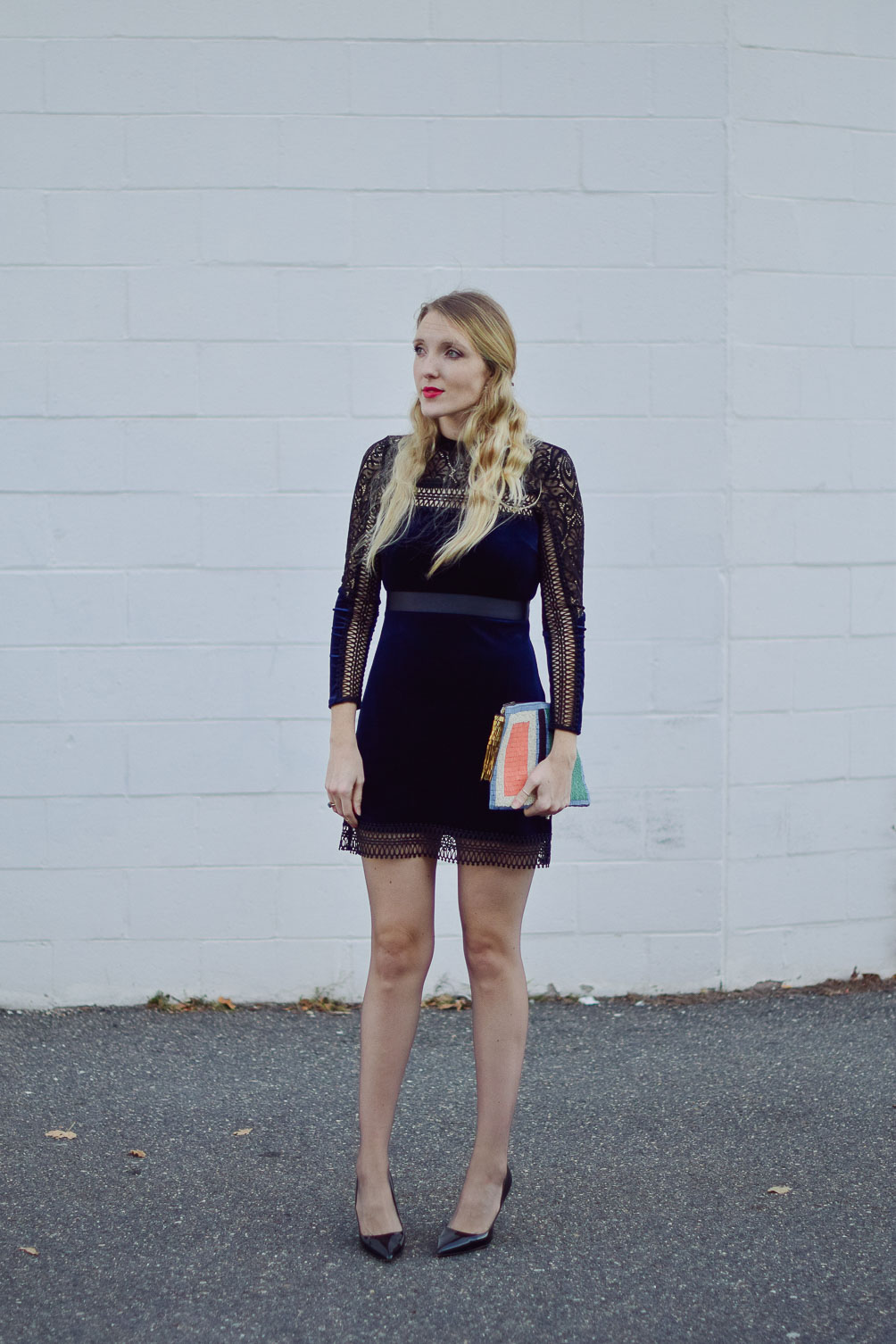 sharing holiday dresses under 150 with blue velvet lace, a beaded clutch, and patent leather heels