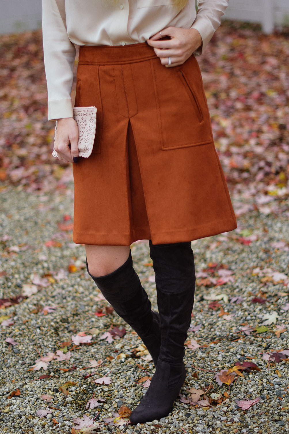 Leslie Musser wearing LOFT rust suede skirt with over the knee boots on one brass fox