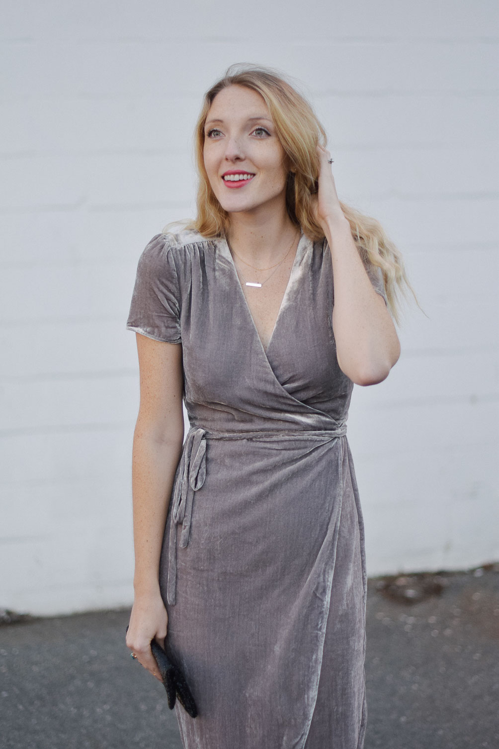 styling a metallic holiday dress party outfit with a beaded clutch