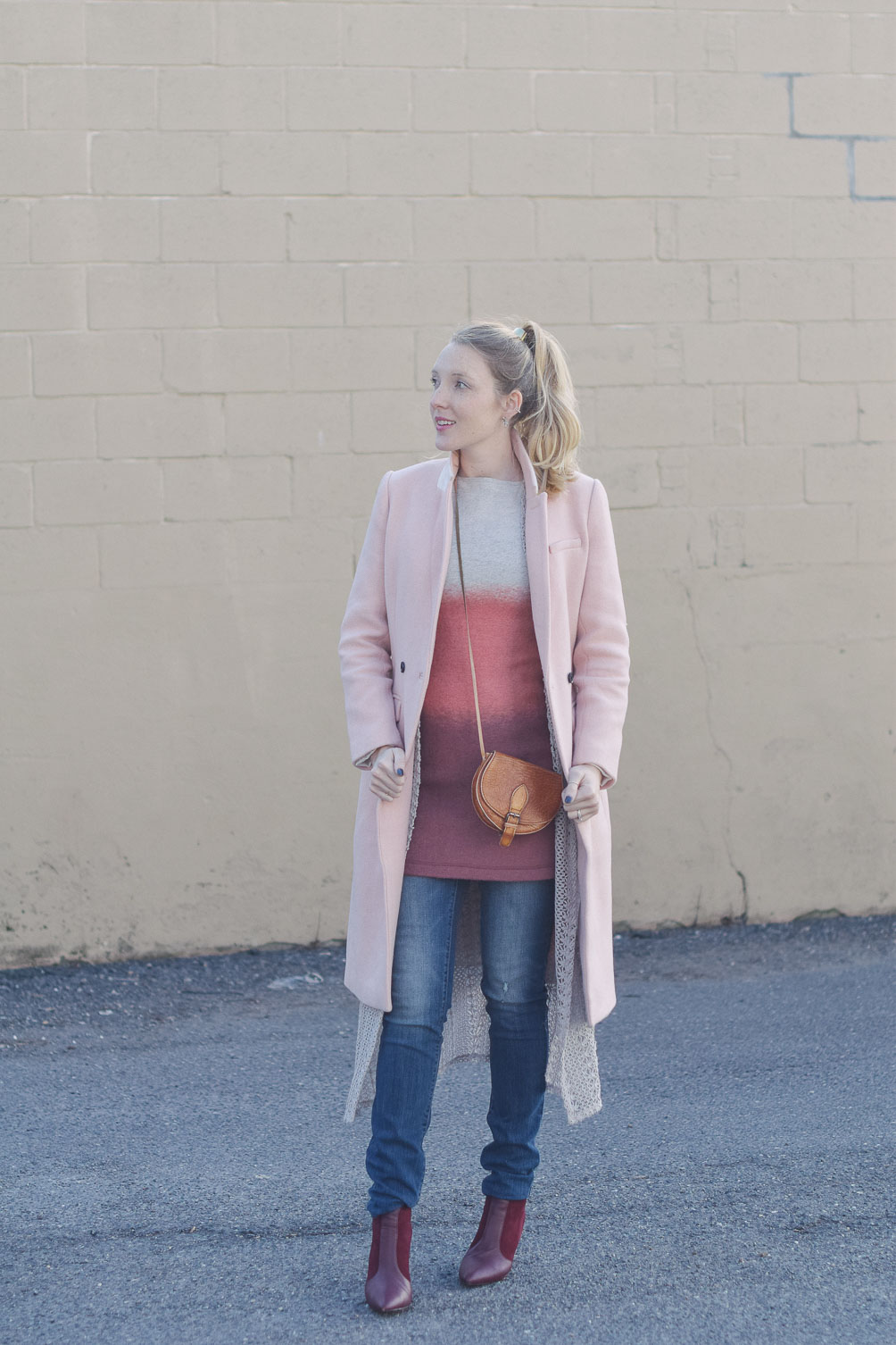 styling pink ombre layers for winter with a duster sweater, maternity jeans, and burgundy boots