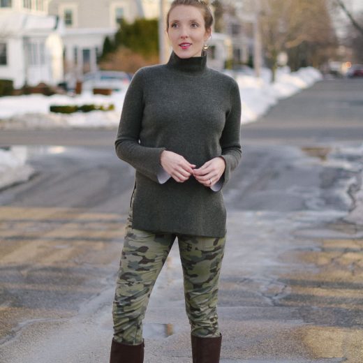 styling skinny camo pants with a cashmere turtleneck sweater and knee high boots