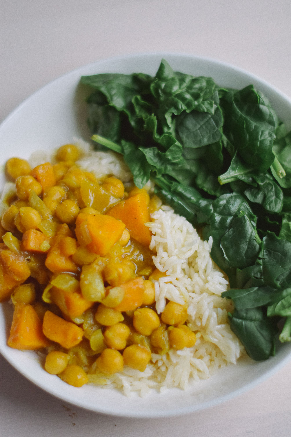 preparing an easy indian-inspired dinner recipe for sweet potato chickpea curry stew