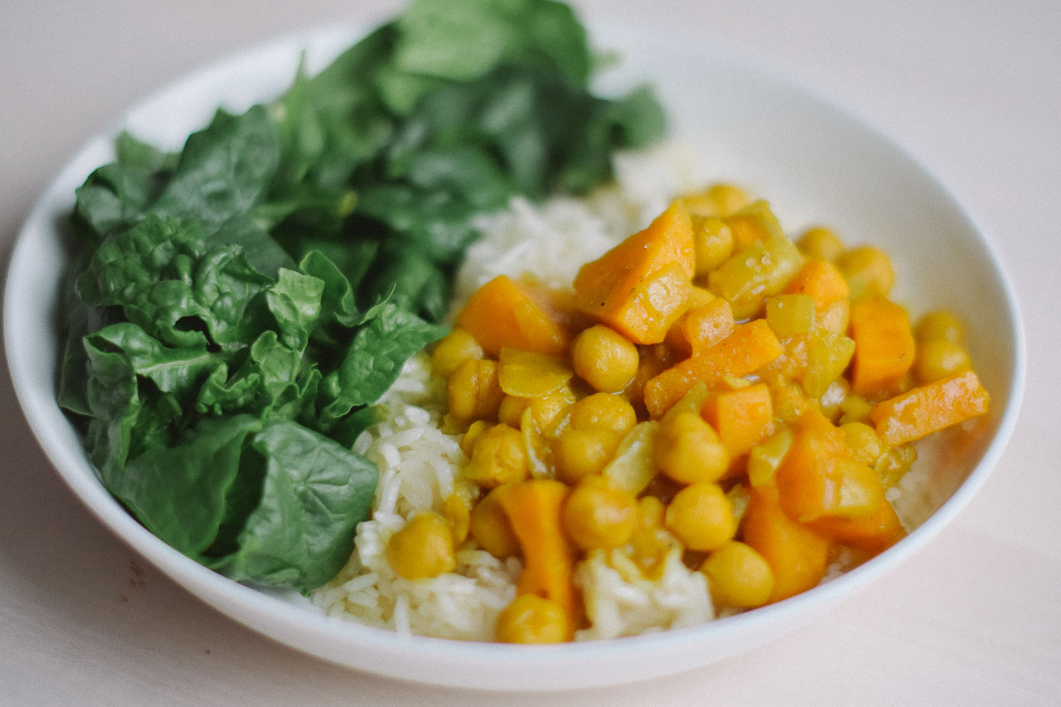 preparing an easy indian-inspired dinner recipe for sweet potato chickpea curry stew