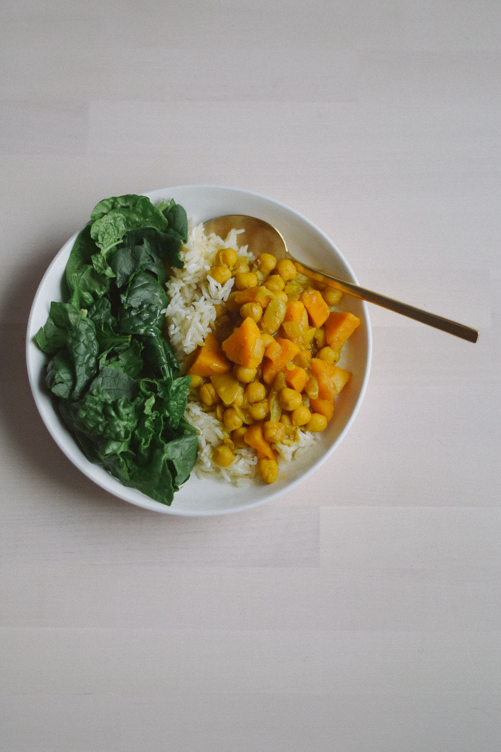 preparing an easy indian-inspired dinner recipe for sweet potato chickpea curry stew