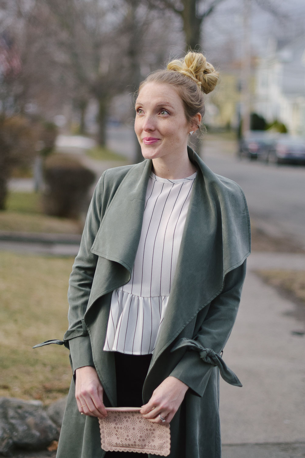 styling a feminine green trench coat for transitioning to spring with peplum details and a pencil skirt