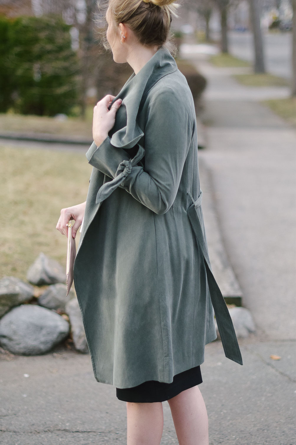 styling a feminine green trench coat for transitioning to spring with peplum details and a pencil skirt