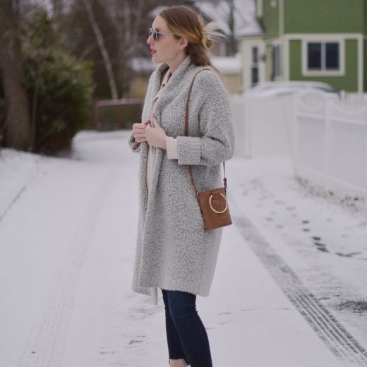 styling a faux suede mini bag with raw edge maternity jeans and an oversized cardigan