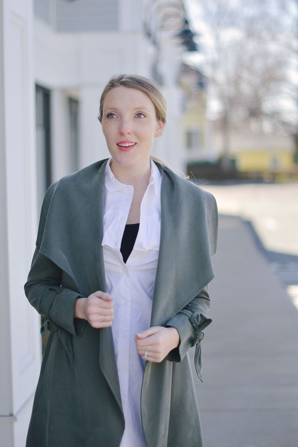 styling a layered spring outfit with olive trench coat, cropped pants, and peep toe mules