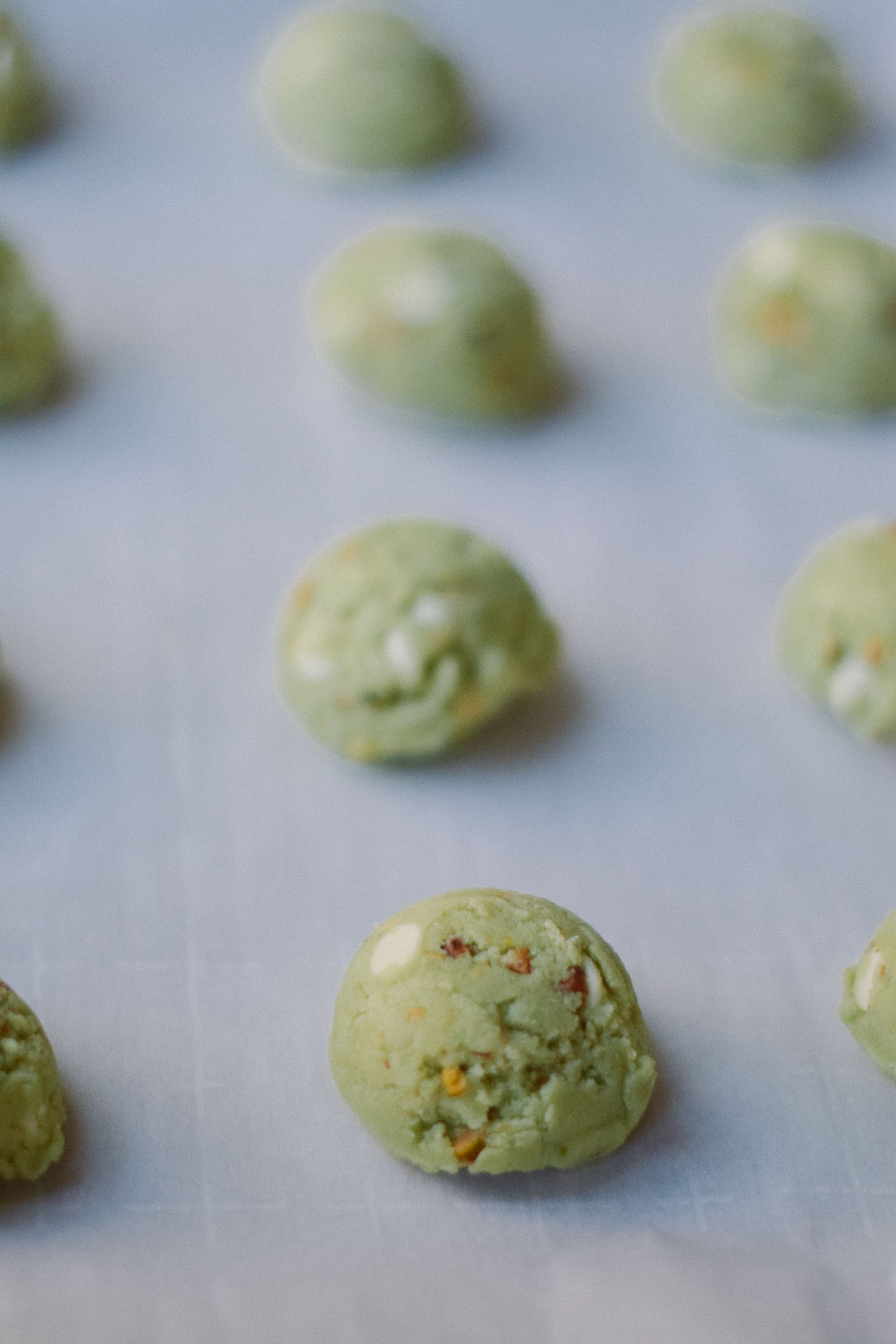 baking a delicious sweet recipe of pistachio cookies for st patrick's day