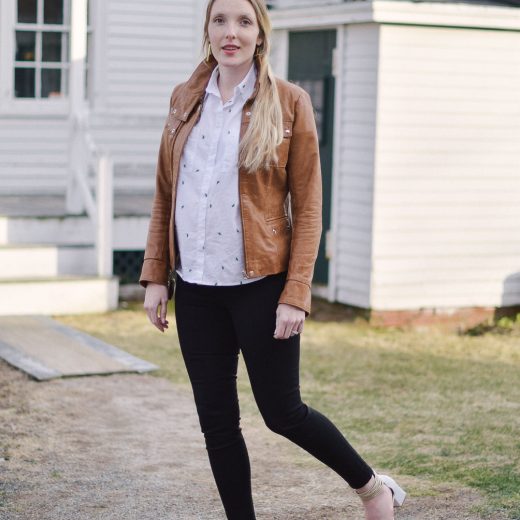 styling easy maternity outfit with cactus print top, skinny jeans, and tan leather jacket