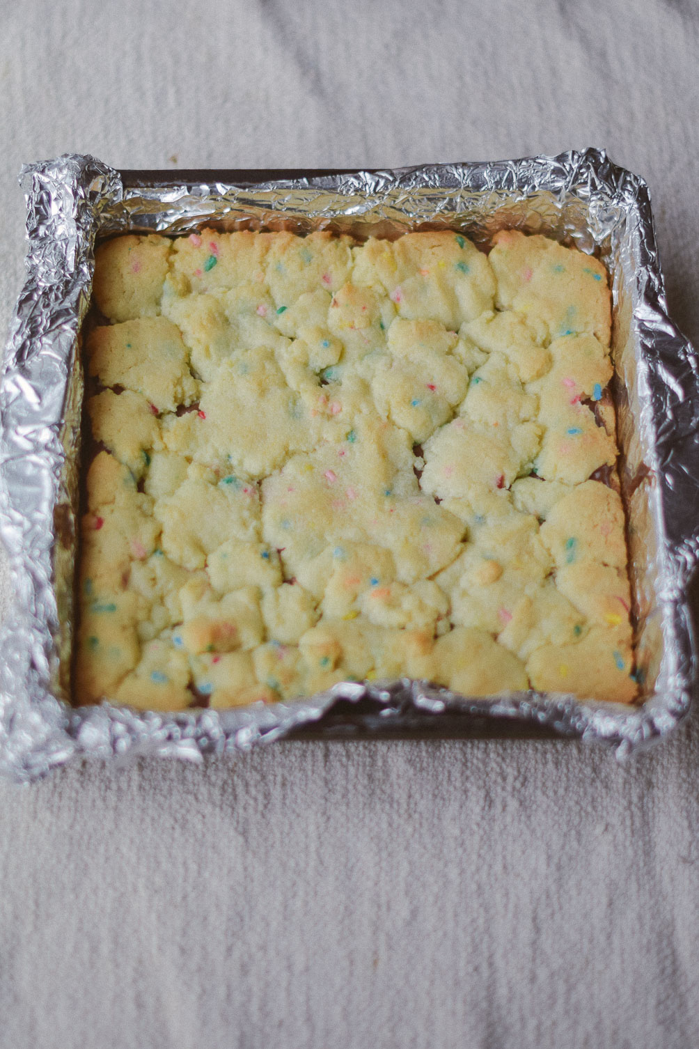 cooking up an easy spring dessert recipe for nutella crumble funfetti cake bars
