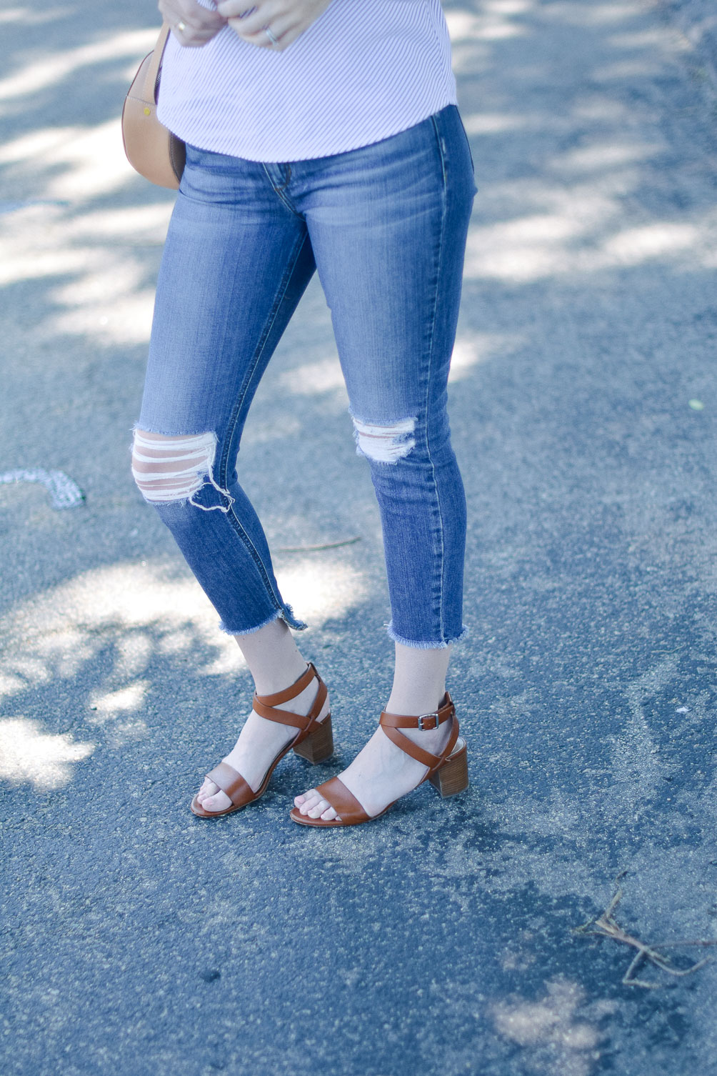 styling a summer outfit with this ruffle one shoulder top and distressed skinny jeans