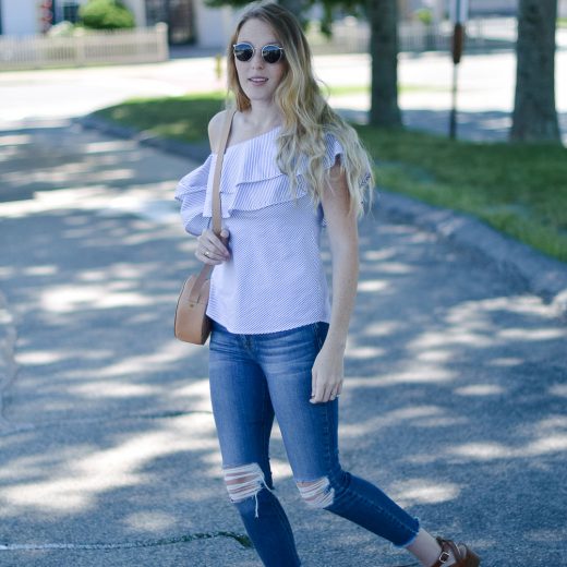 styling a summer outfit with this ruffle one shoulder top and distressed skinny jeans