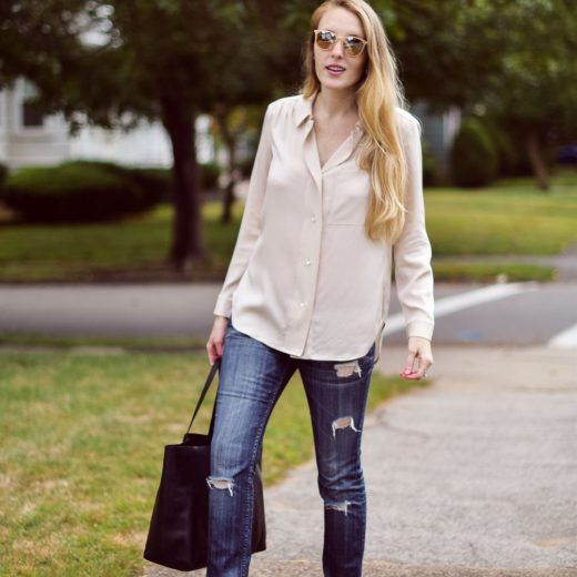 Leslie Musser styling pink fur loafers for fall with distressed skinny jeans, a blush silk top, and black leather tote