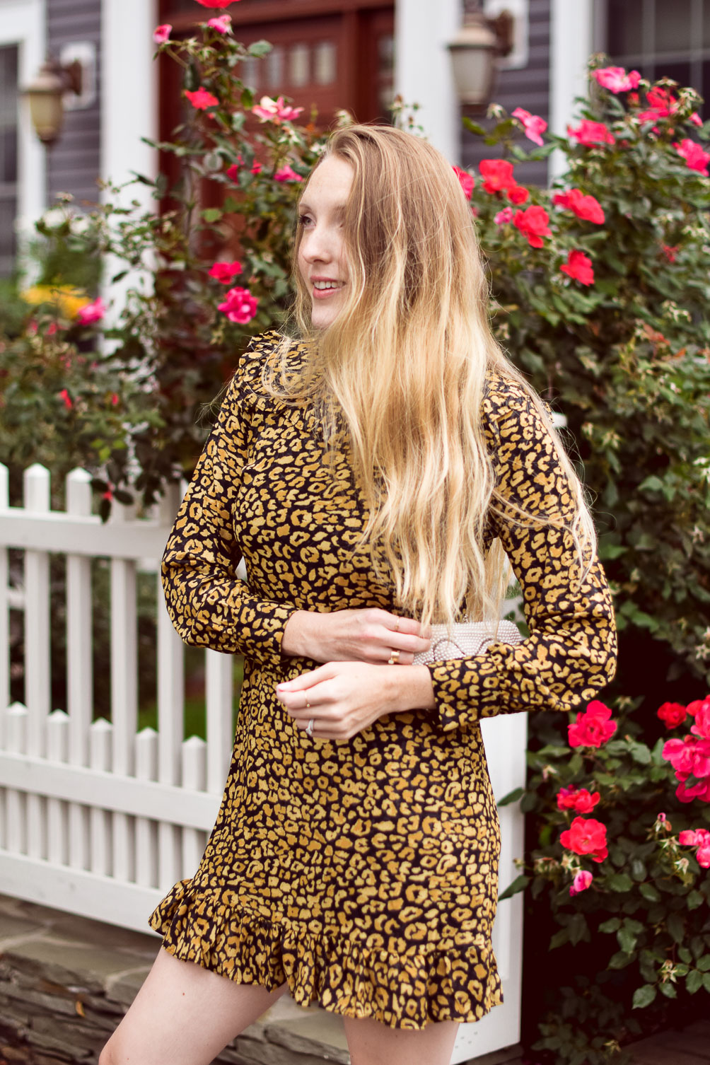 styling a cute fall outfit with this leopard print mini dress and white ankle boots