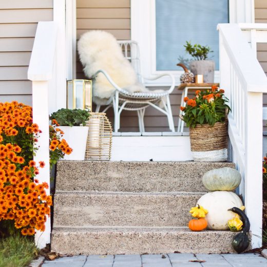 styling a porch with cute and festive outdoor fall decor on a budget