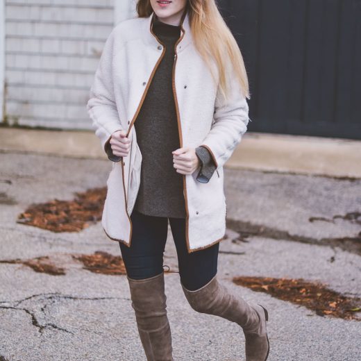 wearing a faux white sherpa jacket for styling neutrals with this cashmere sweater and over the knee Stuart Weitzman boots