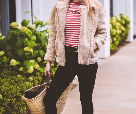 styling a teddy bear jacket as the best outerwear option for winter with a striped top and black skinny jeans