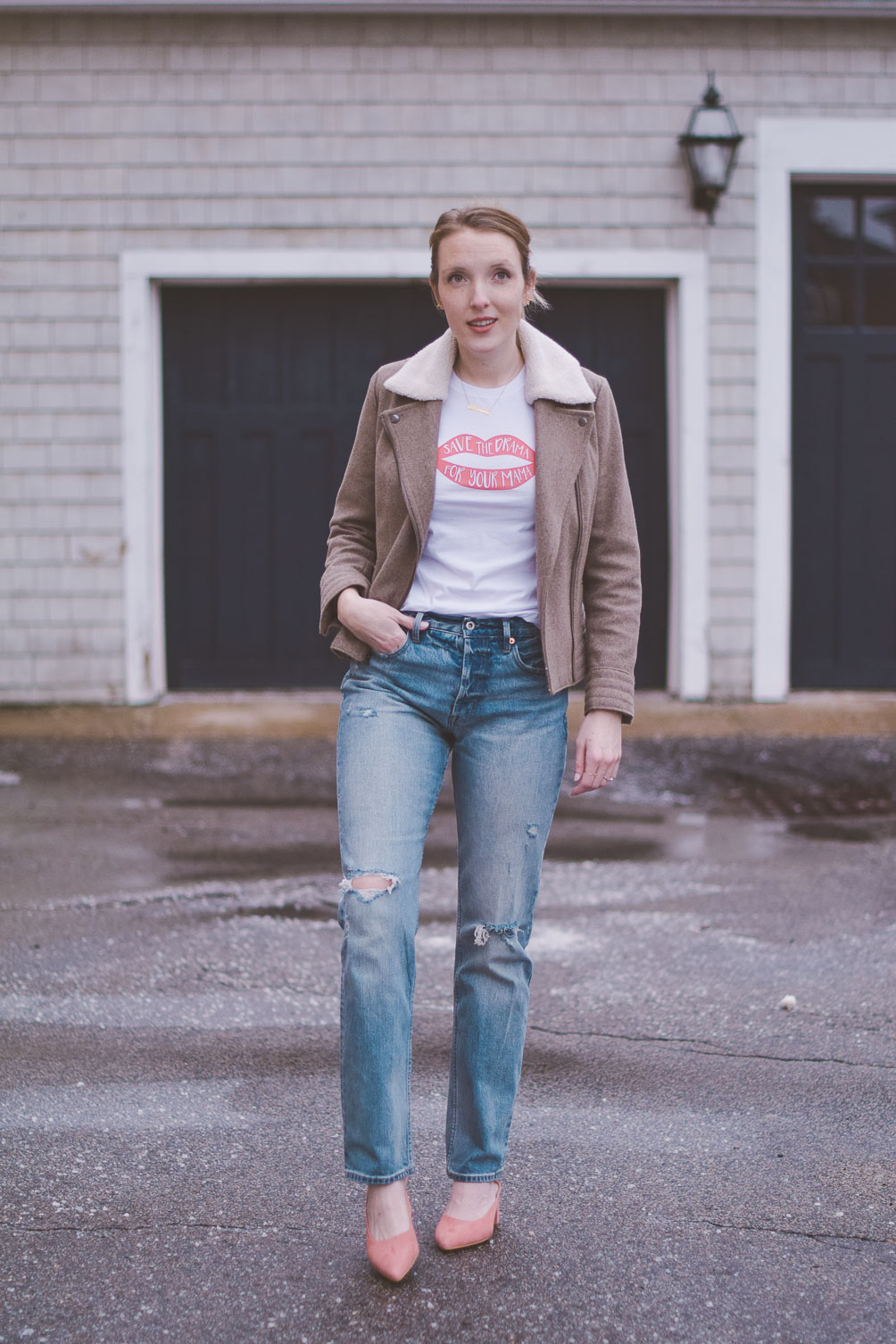 wearing high rise straight jeans with a shearling collar jacket, graphic tee, and pink block heel mules