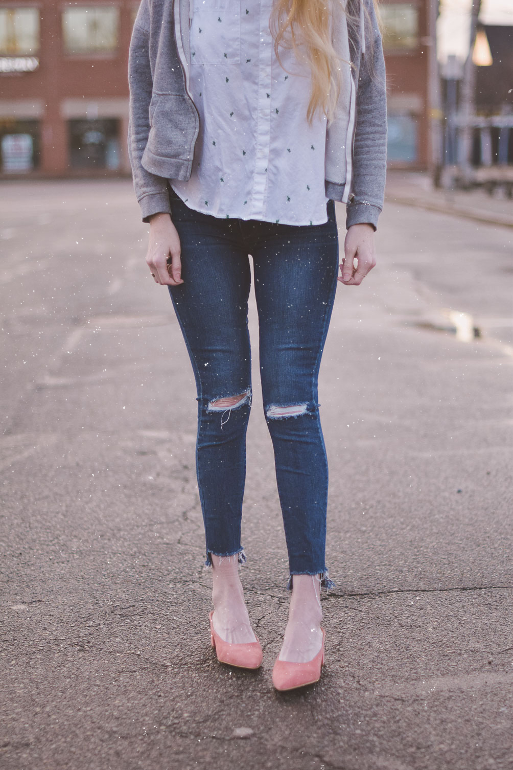 sharing my spring travel style with a gray hoodie, embroidered shirt, destroyed jeans and blush suede mules
