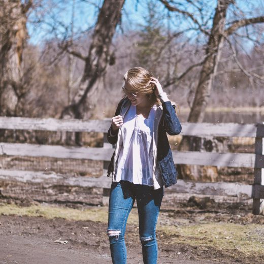 styling a lightweight spring jacket with this grey hoodie, white box top, raw hem jeans, and platform sneakers