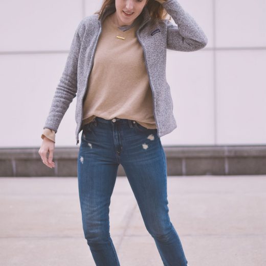 styling neutral layers for an easy, casual, and comfortable spring outfit with this cashmere sweater, raw hem jeans, and white sneakers