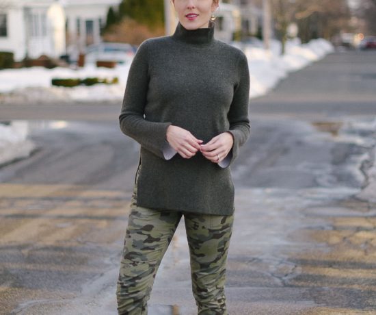 styling skinny camo pants with a cashmere turtleneck sweater and knee high boots