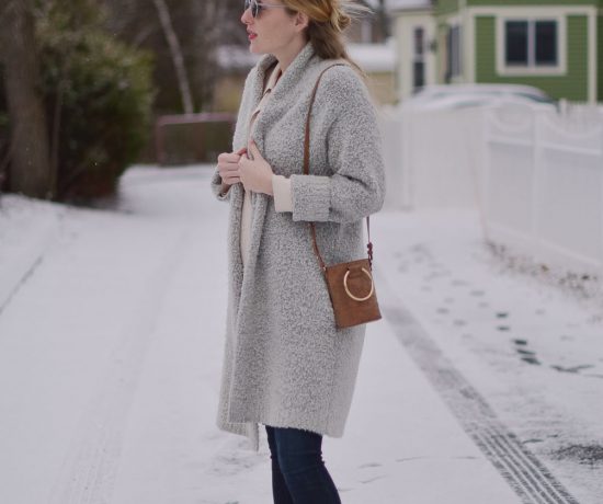 styling a faux suede mini bag with raw edge maternity jeans and an oversized cardigan
