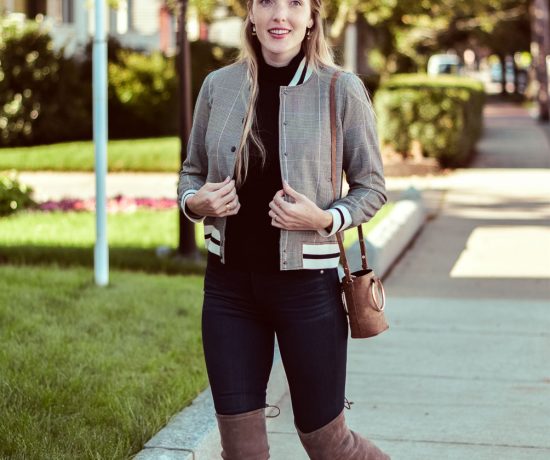 styling a Who What Wear varsity bomber jacket for fall with this black turtleneck, dark skinny jeans, and Stuart Weitzman over-the-knee boots